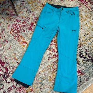 Teal colored women’s ski pants.